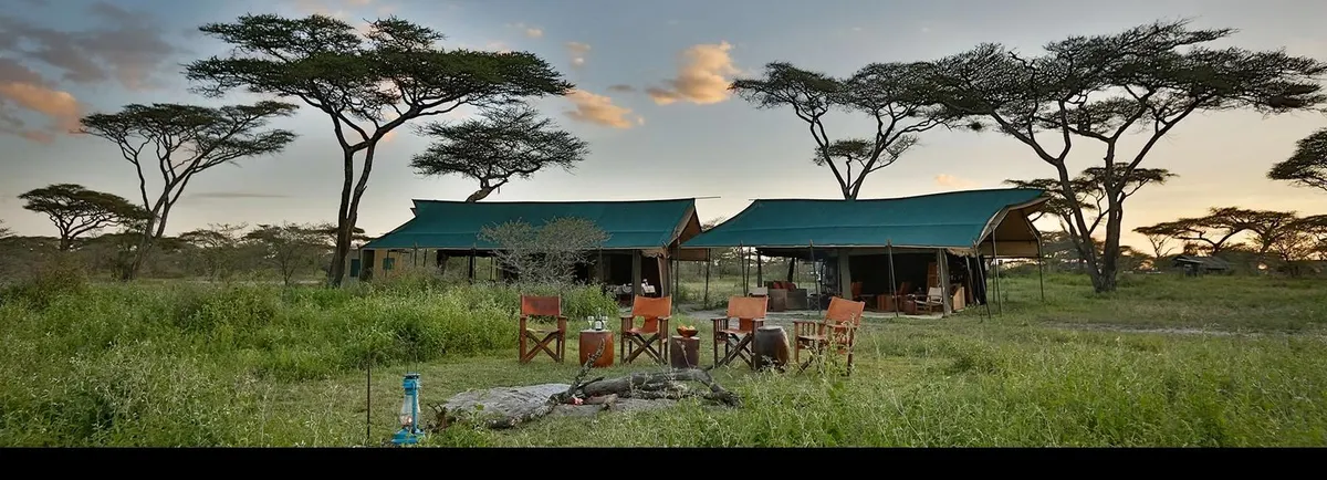 Mess and lounge tents among the acacias