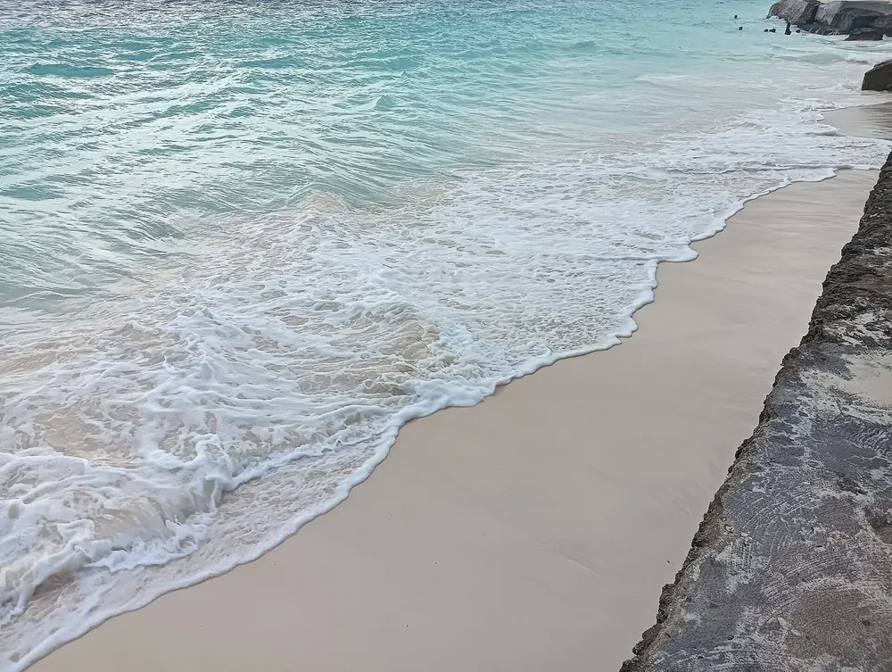 Waves and white sand at Nungwi Beach, Zanzibar, Tanzania